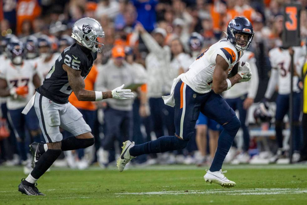 Denver Broncos wide receiver Courtland Sutton (14) blows past Raiders cornerback Decamerion Ric ...