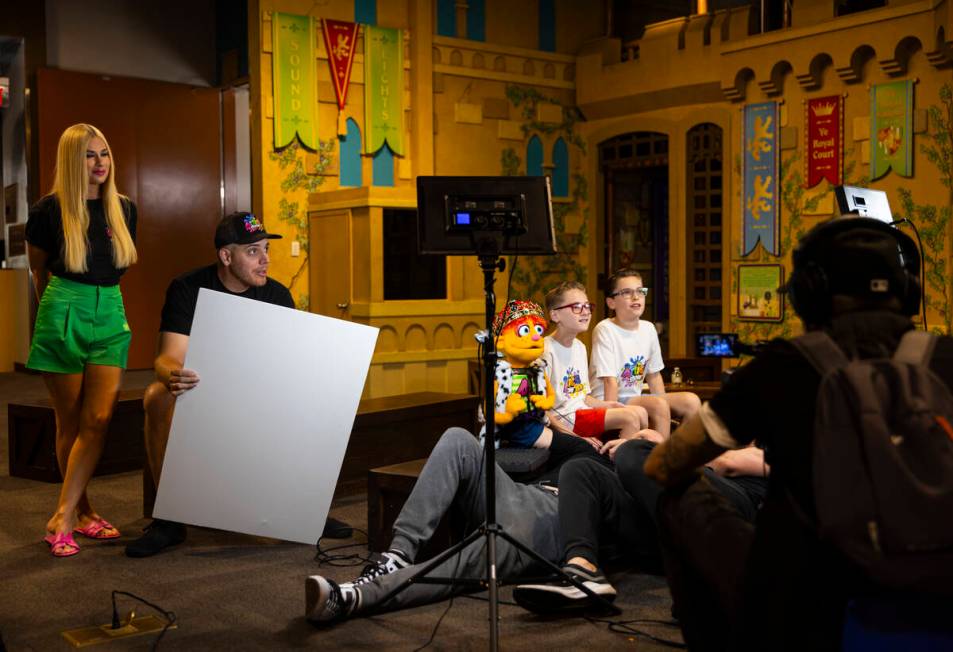 Andy Walmsley, center, puppeteers Artie alongside Dylan Lux, 10, center right, and Dexter Lux, ...