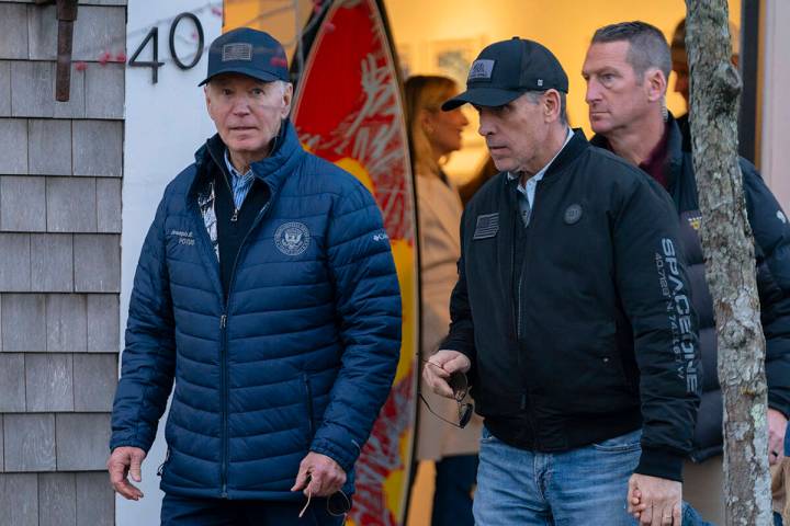 President Joe Biden and son Hunter Biden walk in downtown Nantucket Mass., Friday, Nov. 29, 202 ...