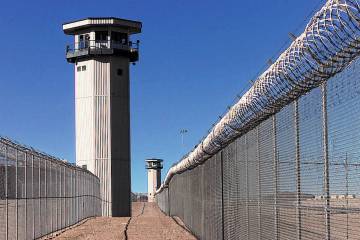 FILE - Guard towers at High Desert Prison near Indian Springs. (Las Vegas Review-Journal/File)