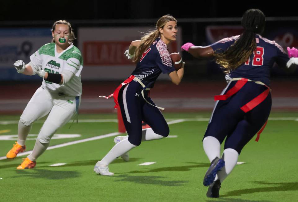 Coronado's Lauren Wood runs the ball after intercepting it from Green Valley during a flag foot ...