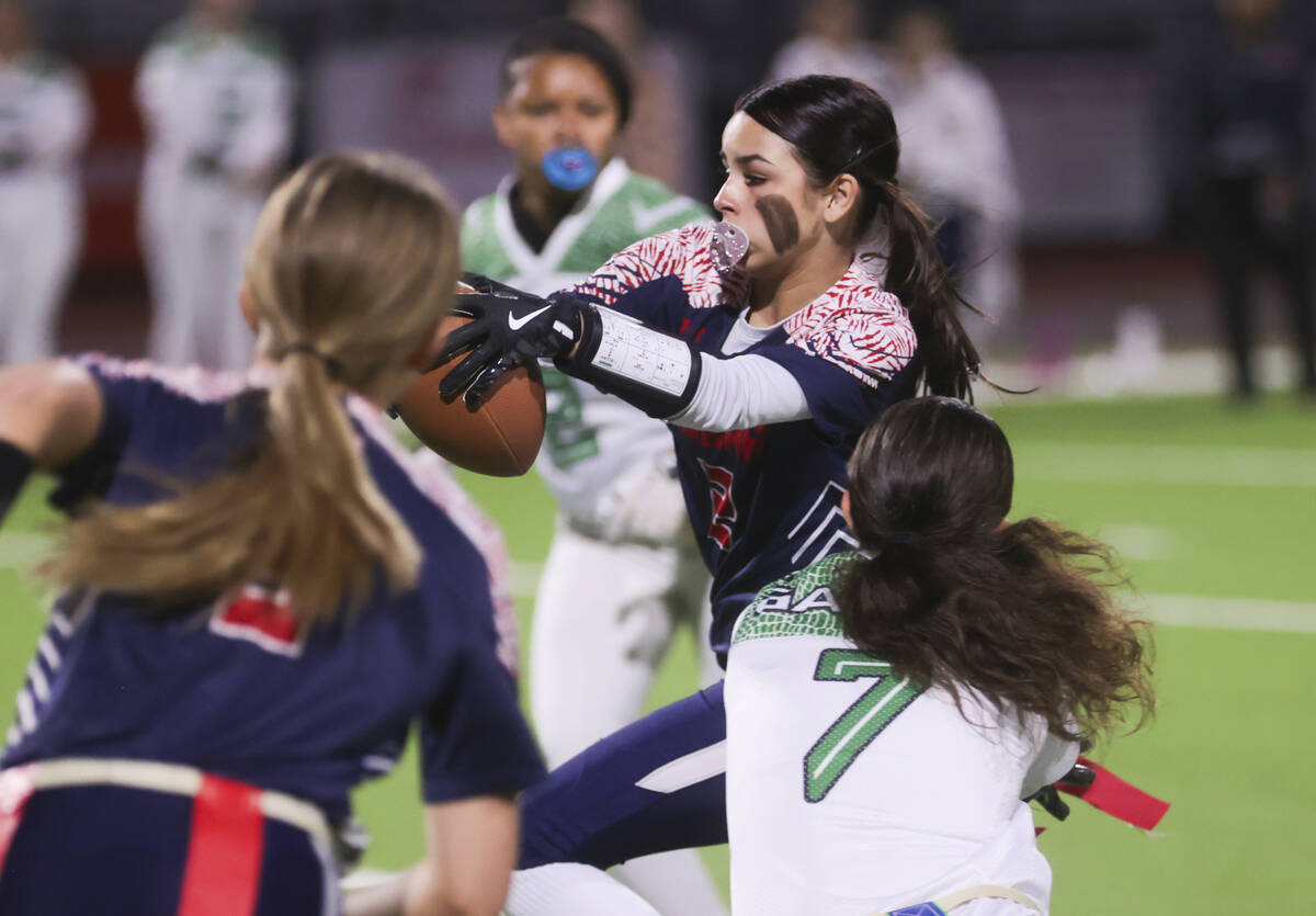 Coronado's Maddy Aguilar (2) tries to get past Green Valley's Lyla Baxter (7) during a flag foo ...