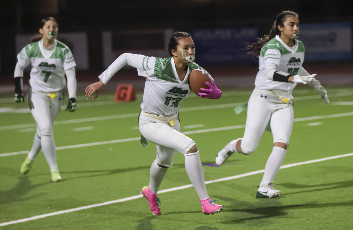 Green Valley's Gracie Rasavong (13) runs the ball after an interception during a flag football ...