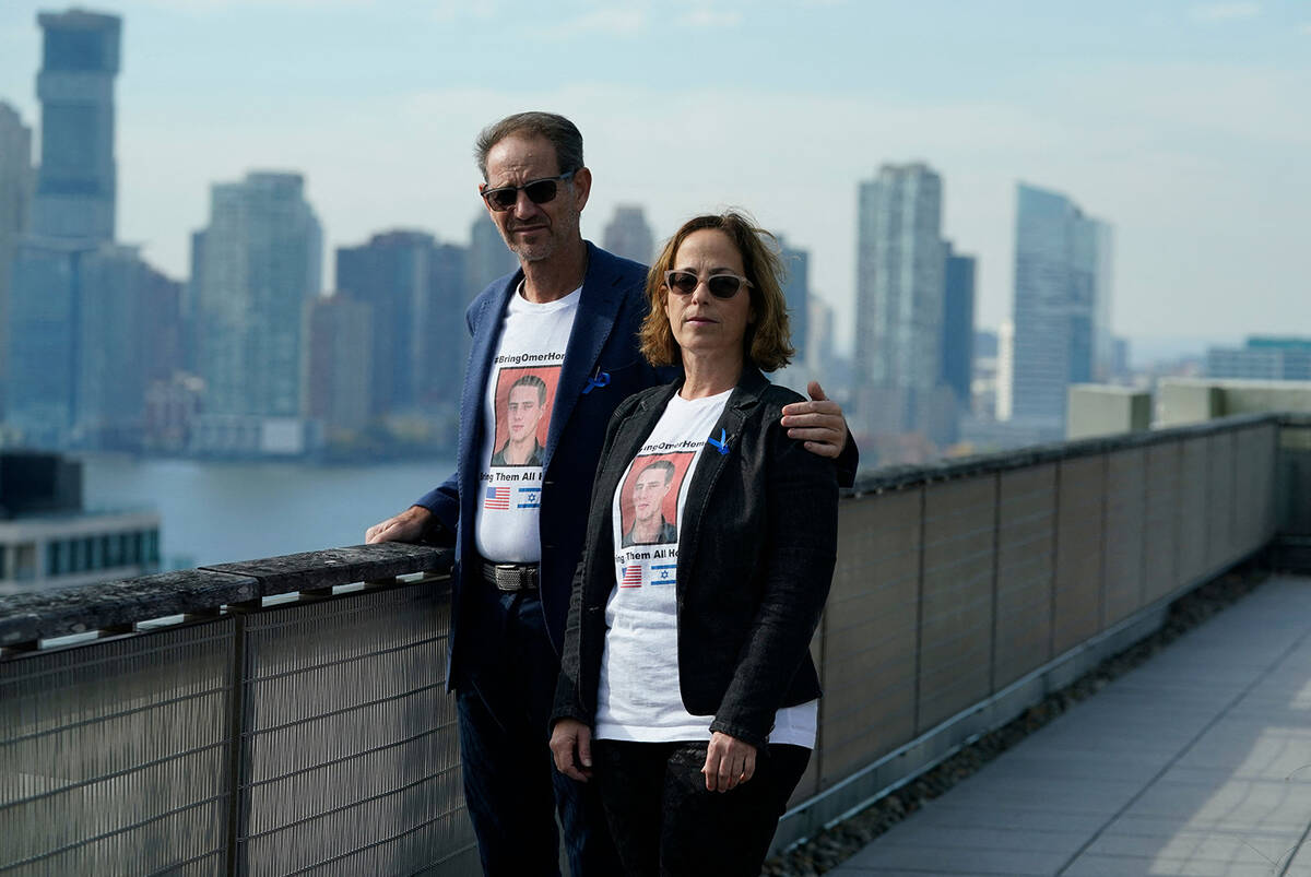 Ronen (left) and Orna Neutra, parents of Omer Neutra, pose for a photo in New York City on Nov. ...