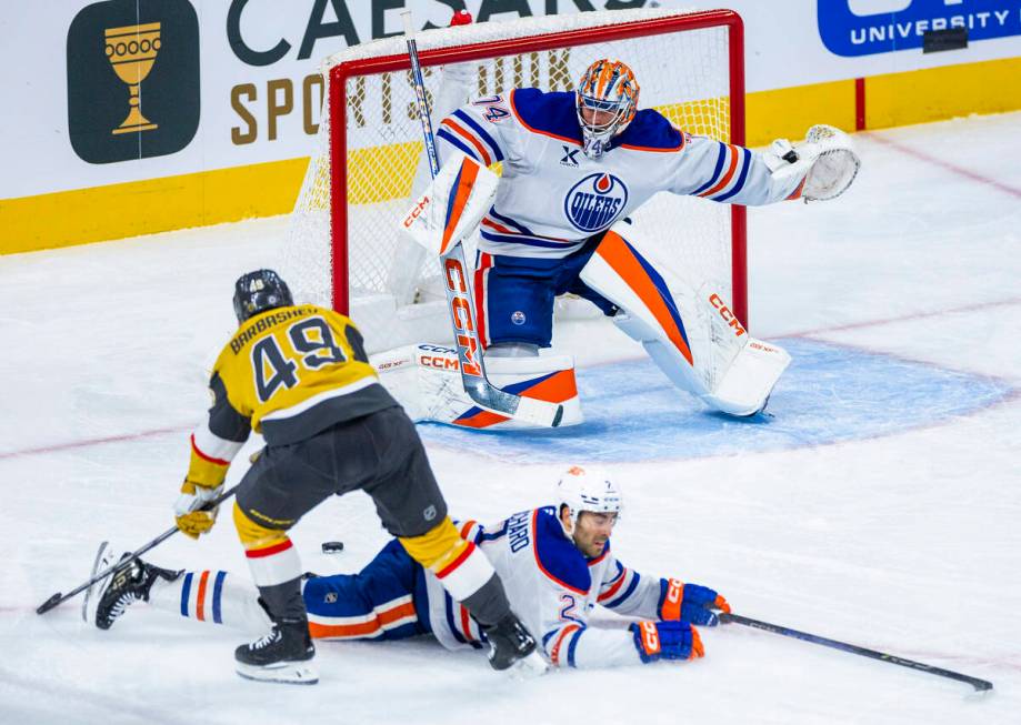 Golden Knights center Ivan Barbashev (49) gets a rebound shot off of Edmonton Oilers defenseman ...