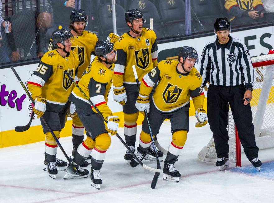 Golden Knights center Ivan Barbashev (49) and teammates celebrate his goal against Edmonton Oil ...