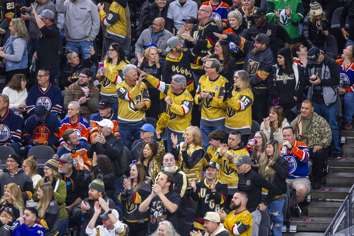 Golden Knights fans celebrate a goal against the Edmonton Oilers during the first period of the ...