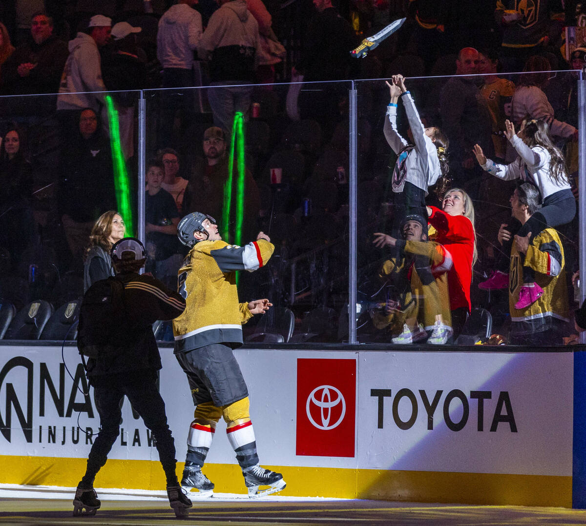 Golden Knights defenseman Brayden McNabb (3) tosses sword to a fan as a player of the game agai ...