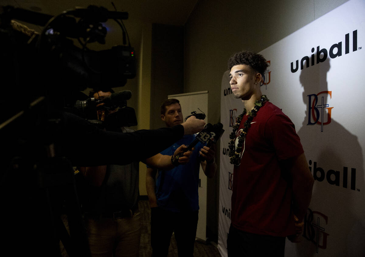 Bishop Gorman wide receiver Derek Meadows is questioned by the media after signing a financial ...