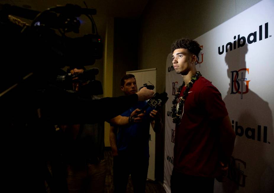 Bishop Gorman wide receiver Derek Meadows is questioned by the media after signing a financial ...