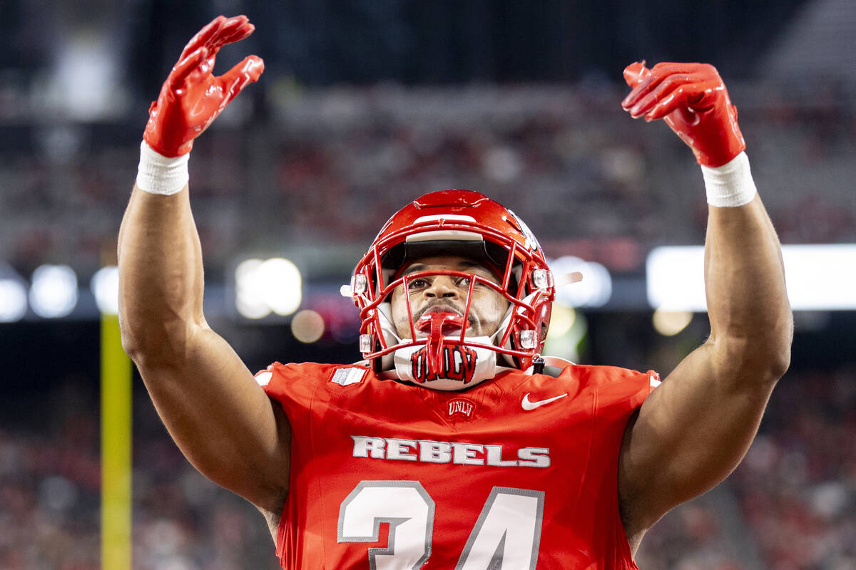 UNLV linebacker Tyray O'Dell (34) cheers on the crowd during the NCAA college football game aga ...