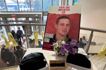 An image of Omer Neutra is displayed at his memorial service Tuesday, Dec. 3, 2024 at the Midwa ...