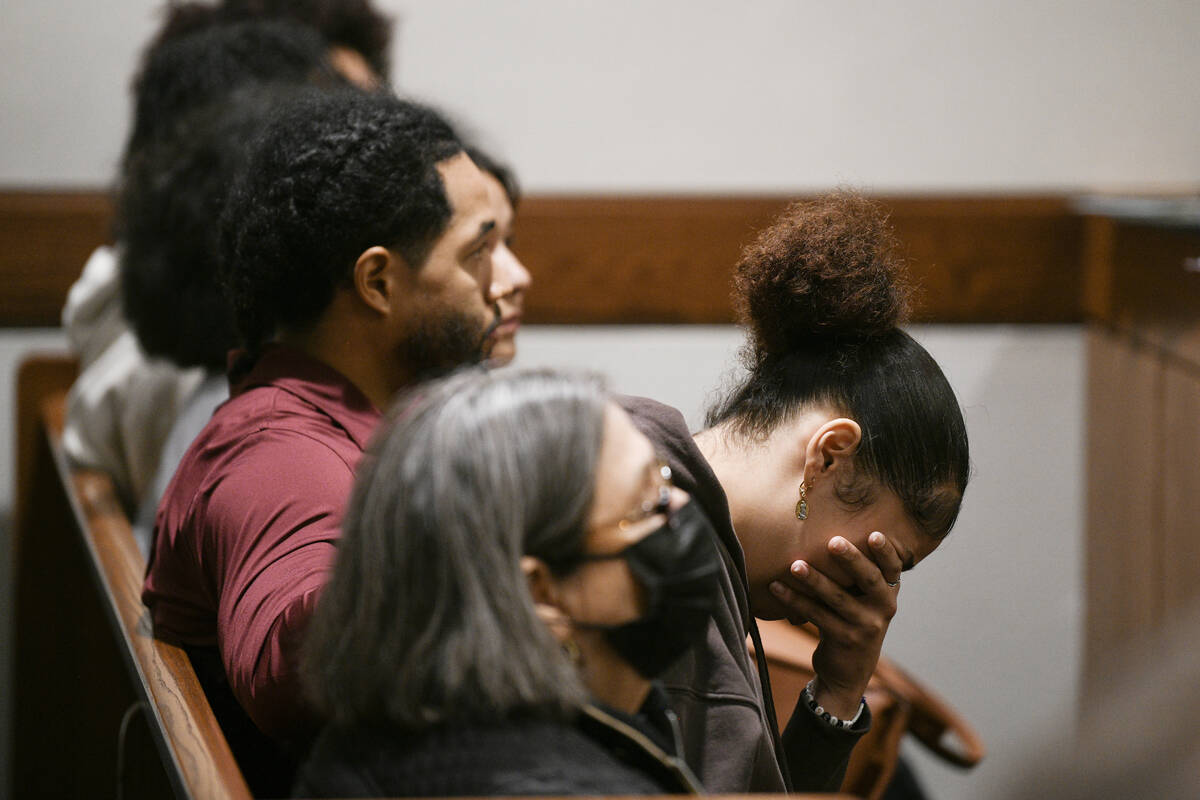 Family members react as Antwone Washington appears on a monitor while being arraigned in Hender ...