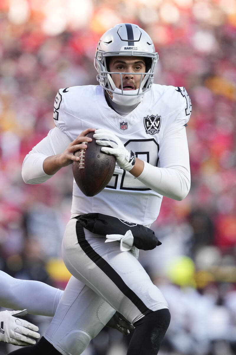 Las Vegas Raiders quarterback Aidan O'Connell looks to pass against the Kansas City Chiefs Frid ...