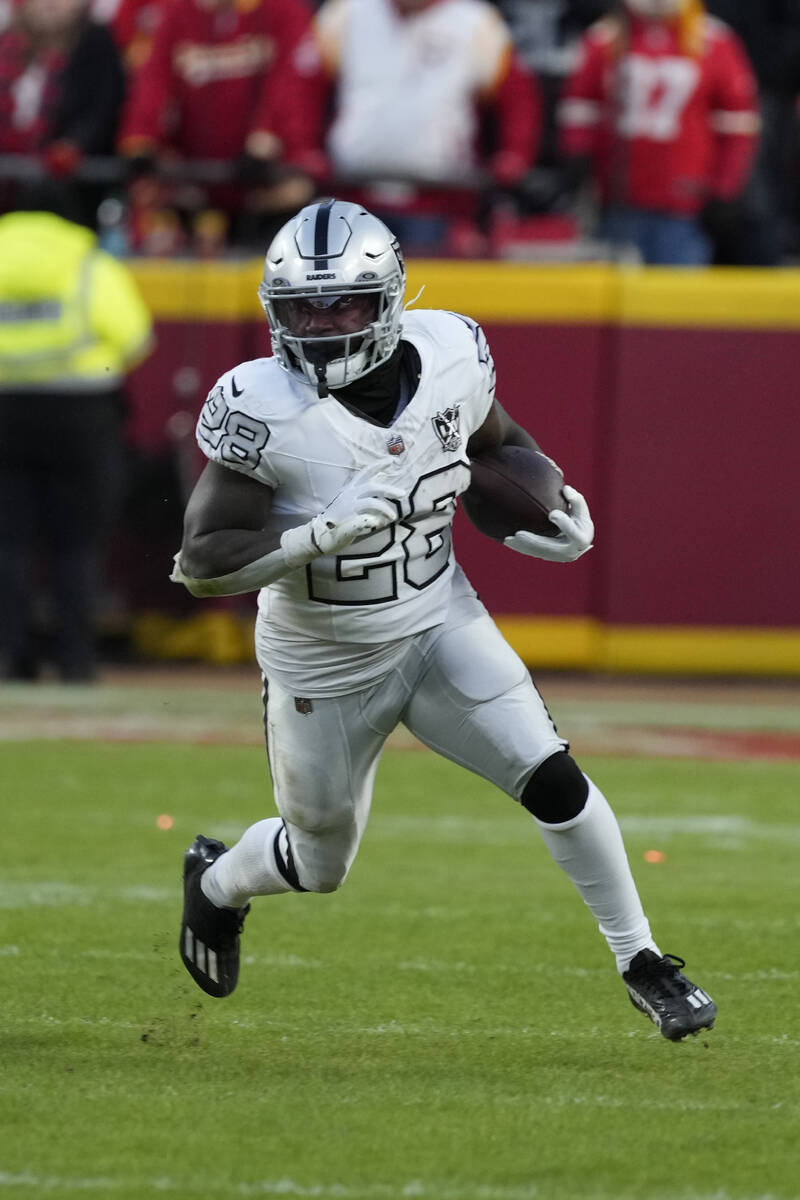 Las Vegas Raiders running back Sincere McCormick runs against the Kansas City Chiefs during an ...