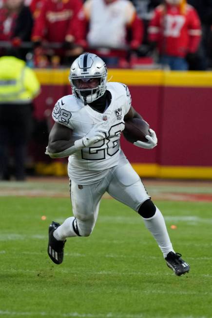 Las Vegas Raiders running back Sincere McCormick runs against the Kansas City Chiefs during an ...