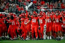 UNLV cheer during a timeout during the second half of an NCAA college football game against Nev ...