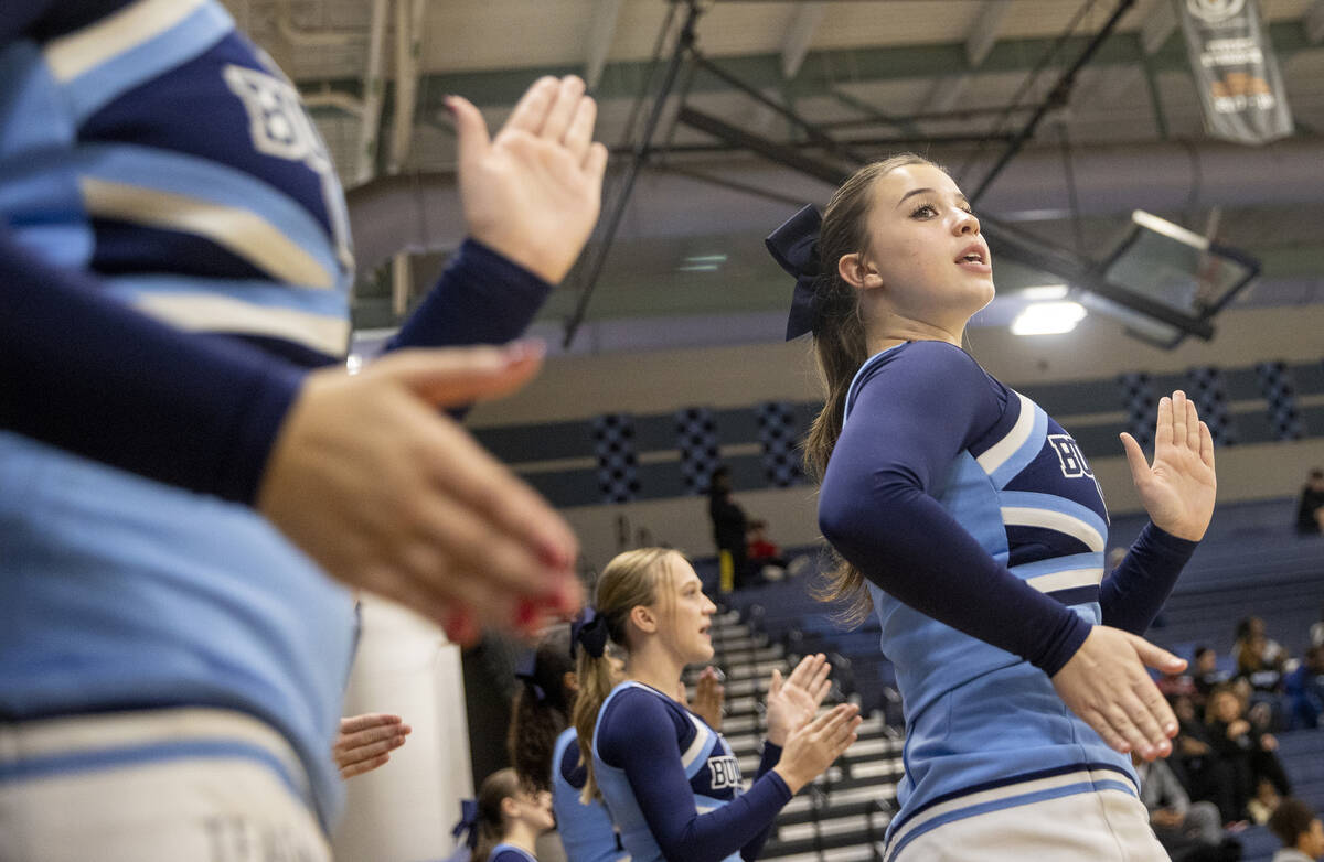 Centennial cheerleaders chant during the high school girls basketball game against Clark at Cen ...