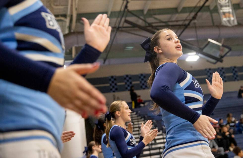 Centennial cheerleaders chant during the high school girls basketball game against Clark at Cen ...