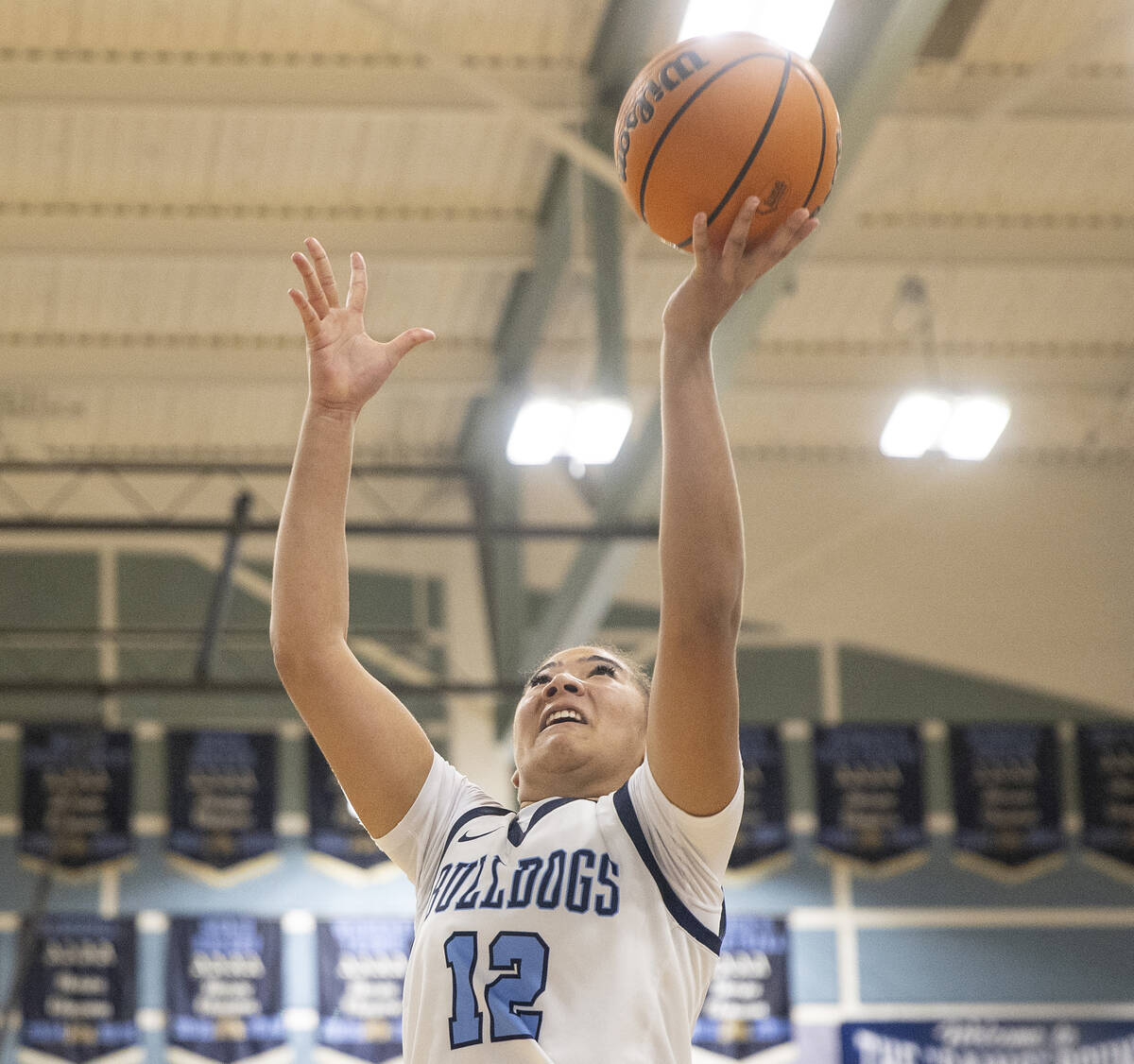 Centennial senior Ayla Williams (12) attempts a layup during the high school girls basketball g ...