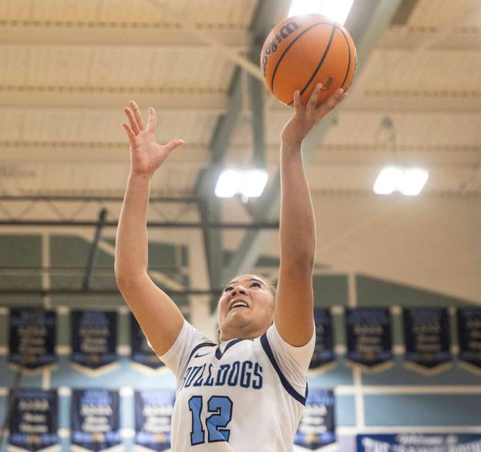 Centennial senior Ayla Williams (12) attempts a layup during the high school girls basketball g ...