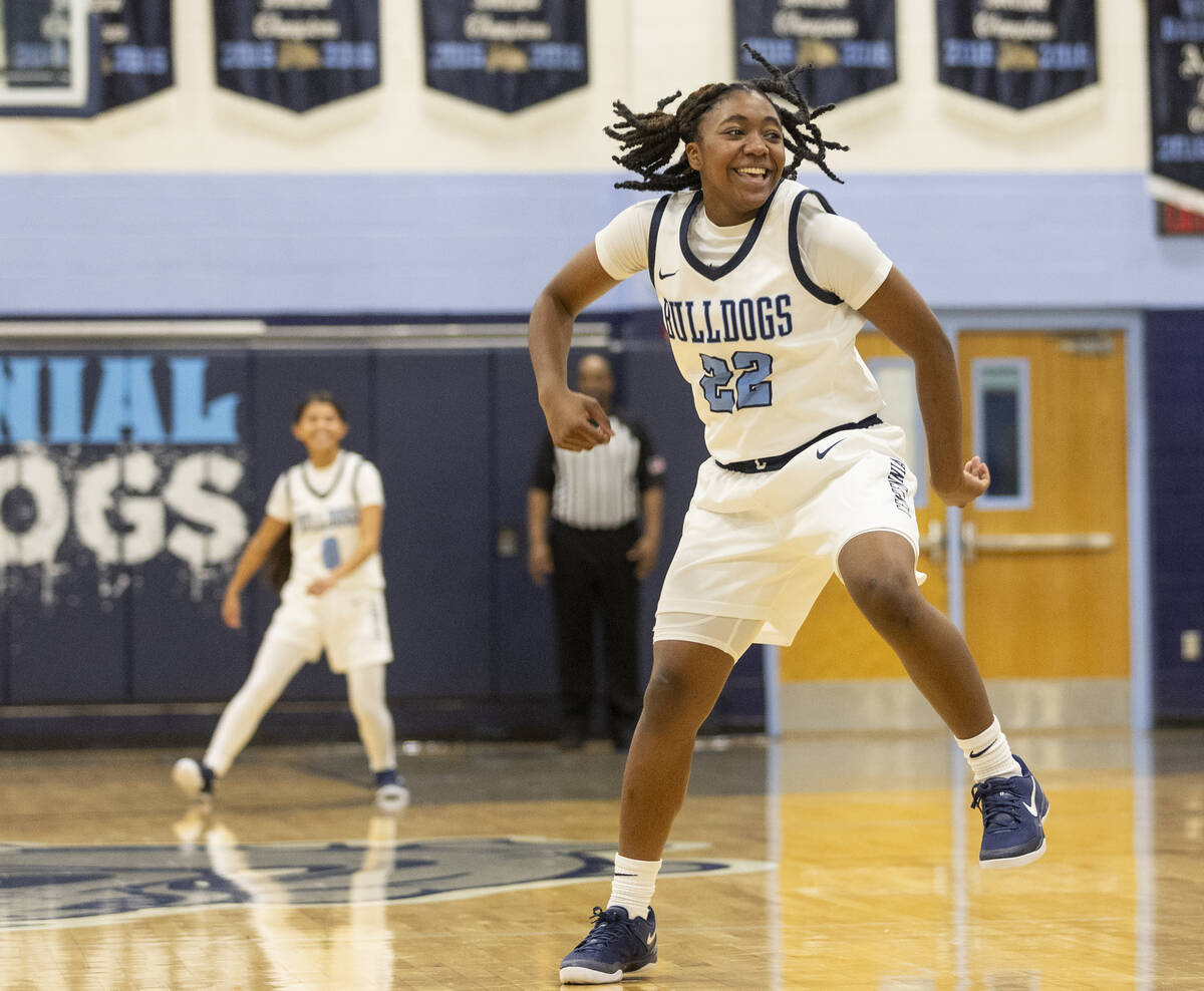 Centennial freshman Peyton Bension (22) celebrates during the high school girls basketball game ...