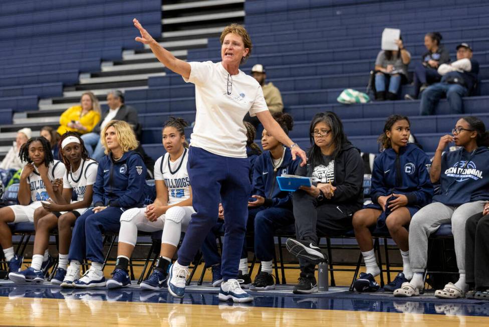 Centennial Head Coach Karen Weitz tells her team what to do during the high school girls basket ...