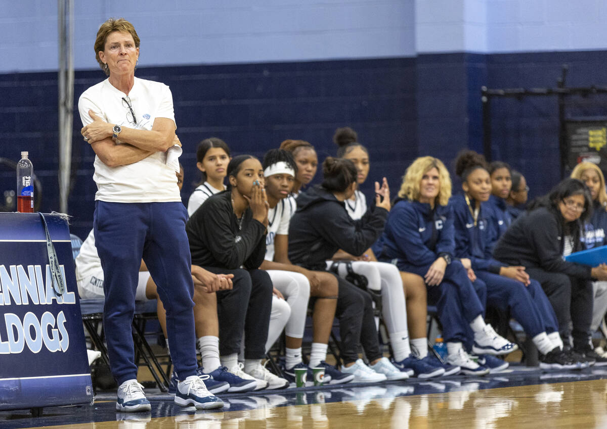 Centennial Head Coach Karen Weitz watches the play during the high school girls basketball game ...