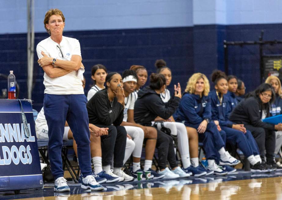 Centennial Head Coach Karen Weitz watches the play during the high school girls basketball game ...