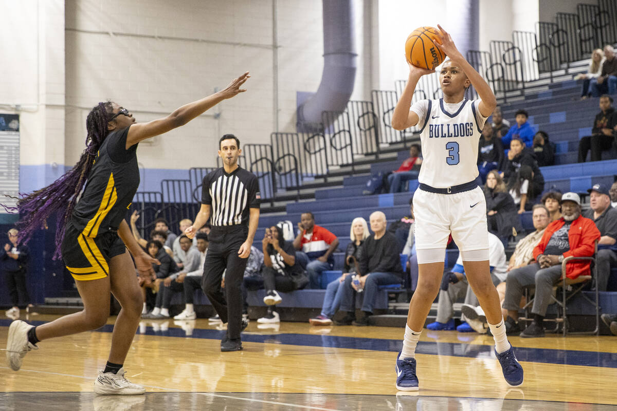 Centennial freshman D'arrah Mitchell (3) attempts a three-point shot during the high school gir ...