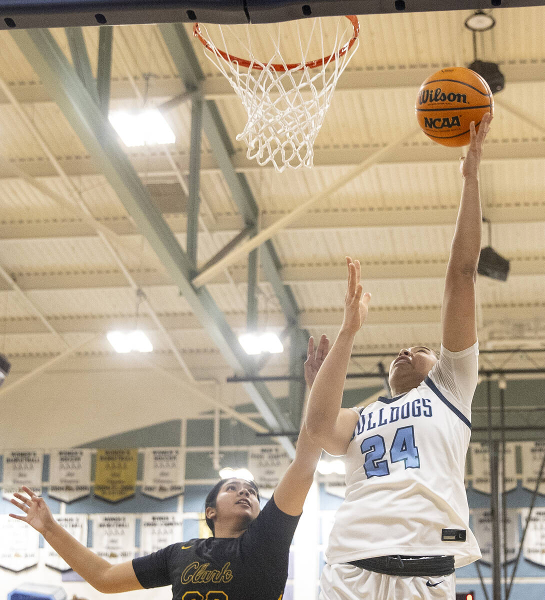 Centennial sophomore Nation Williams (24) attempts a layup during the high school girls basketb ...