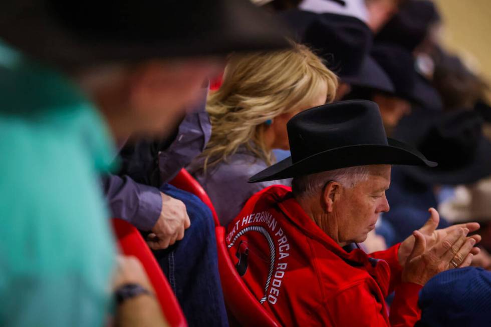 A rodeo fan claps during the final day of the National Finals Breakaway Roping event at South P ...