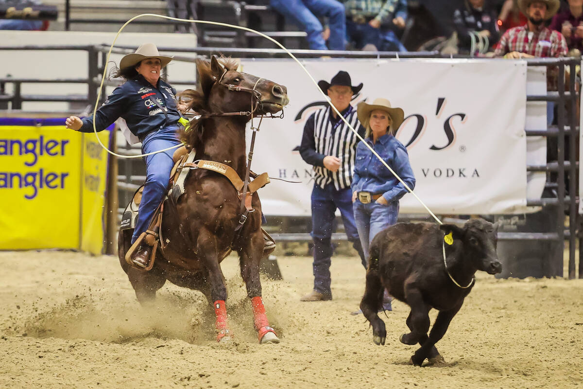 Kelsie Domer ropes a calf during the final day of the National Finals Breakaway Roping event at ...