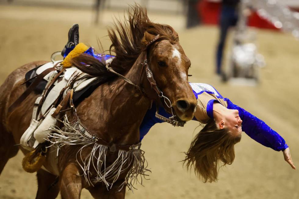 A trick rider performs during the final day of the National Finals Breakaway Roping event at So ...