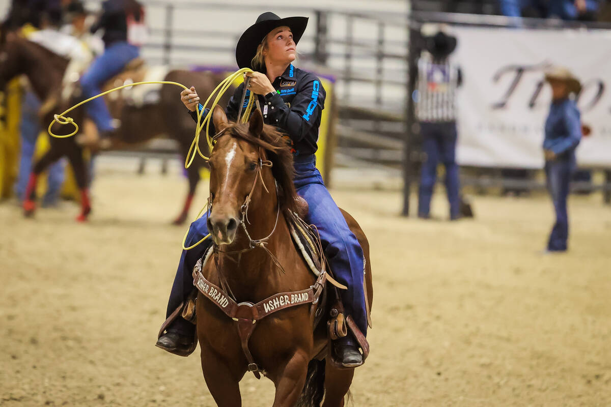 Breakaway roper Taylor Munsell rides off the dirt during the final day of the National Finals B ...