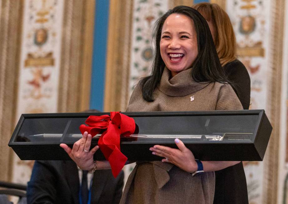 Camille Calimlim Touton, current Bureau of Reclamation commissioner, holds a gate bar as a gift ...