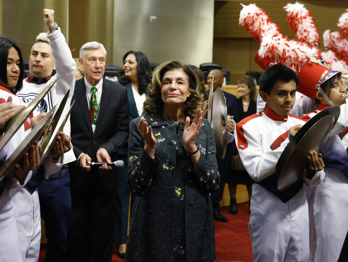 Mayor Shelley Berkley reacts as Valley High School marching band performs after Berkley sworn i ...