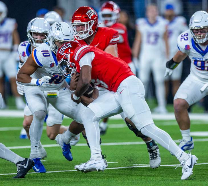 UNLV quarterback Hajj-Malik Williams (6) battles for more yards on a run against Boise State Br ...