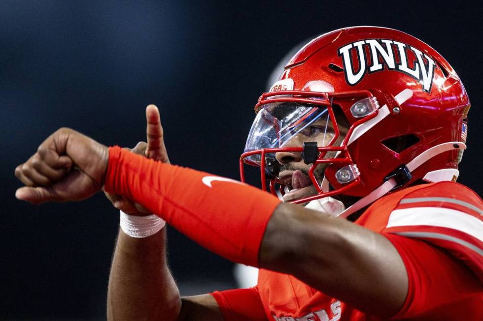 UNLV quarterback Hajj-Malik Williams (6) taps his wrist after scoring a touchdown during the NC ...