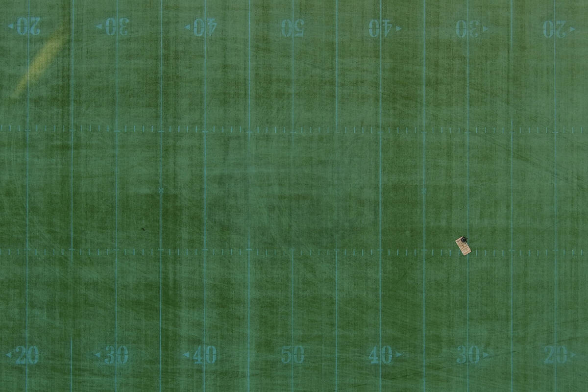 An aerial view of the playing field with an abandoned table and chair at Sam Boyd Stadium Wedne ...