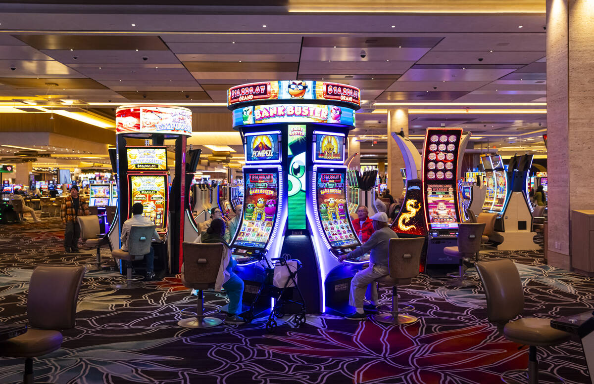 Casino guests play slot machines at the Durango on Monday, Dec. 2, 2024, in Las Vegas. (Chase S ...