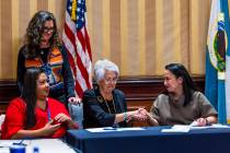 Colorado River Indian Tribal Council Chairwoman Amelia Flores, center, shakes hands with curren ...