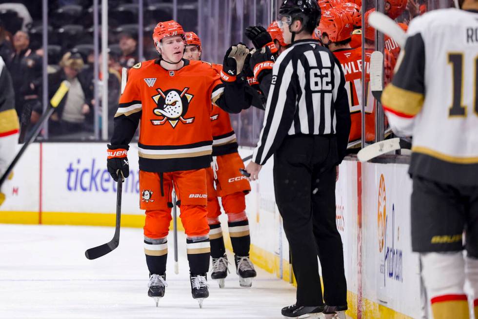 Anaheim Ducks defenseman Jackson LaCombe celebrates with the bench after scoring against the Ve ...