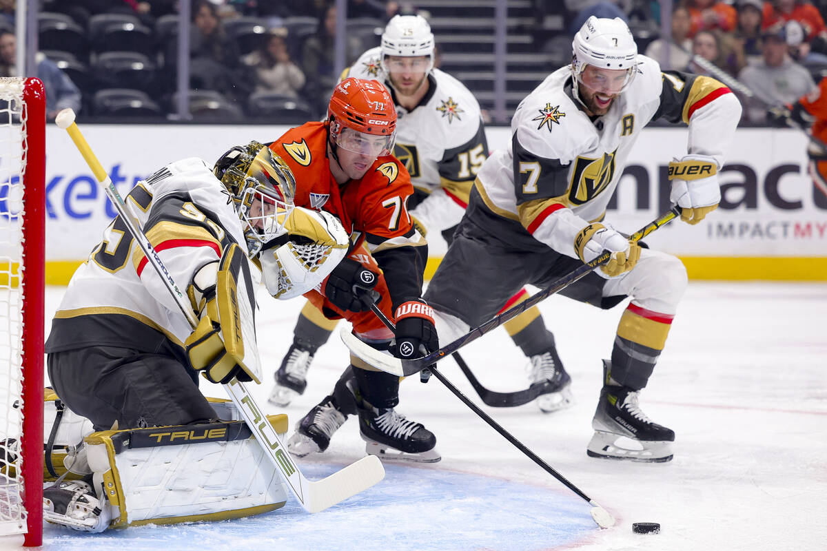 Anaheim Ducks right wing Frank Vatrano, center, shoots against Vegas Golden Knights goaltender ...