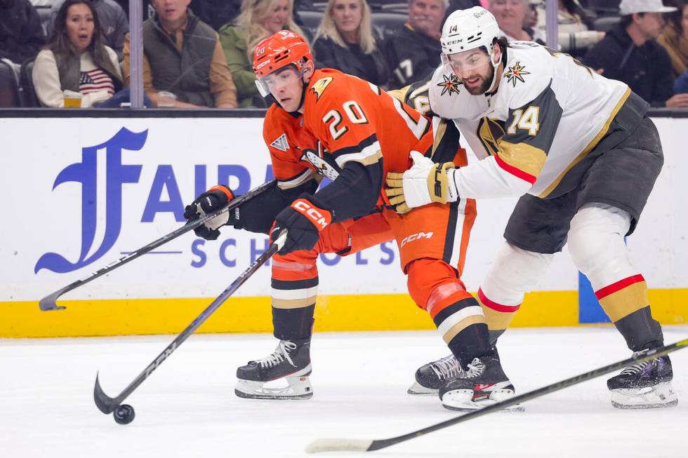 Anaheim Ducks right wing Brett Leason, left, vies for the puck against Vegas Golden Knights def ...