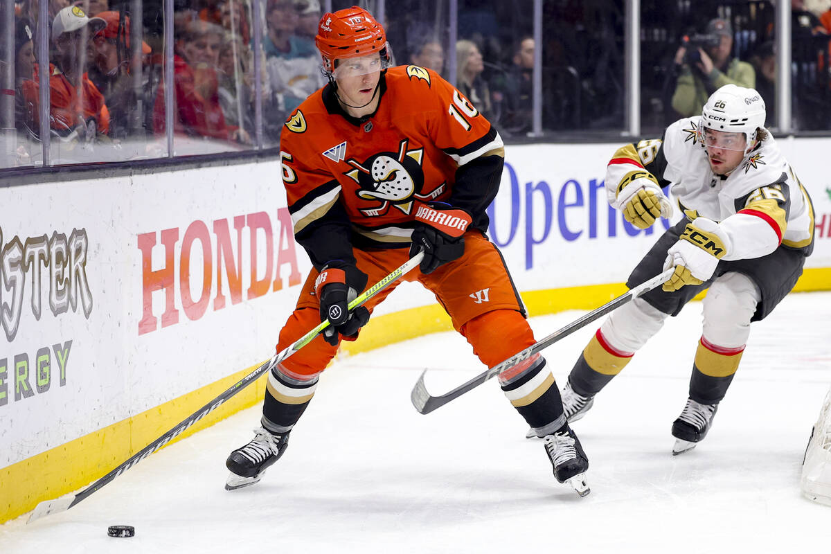 Anaheim Ducks center Ryan Strome, left, and Vegas Golden Knights right wing Alexander Holtz vie ...