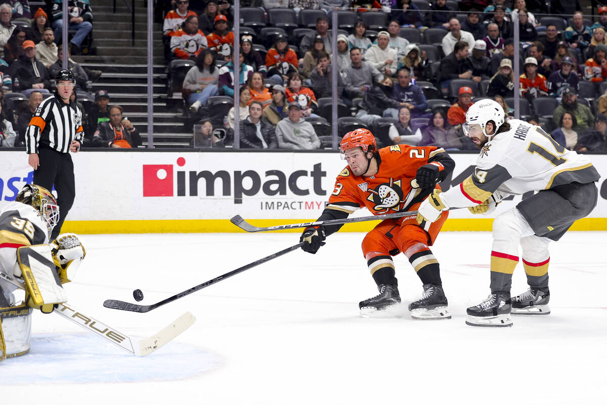 Anaheim Ducks center Mason McTavish, center, shoots against Vegas Golden Knights goaltender Ily ...