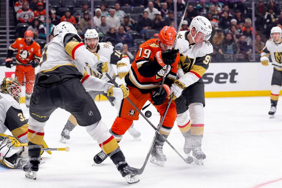 Anaheim Ducks right wing Troy Terry (19) vies for the puck against Vegas Golden Knights defense ...