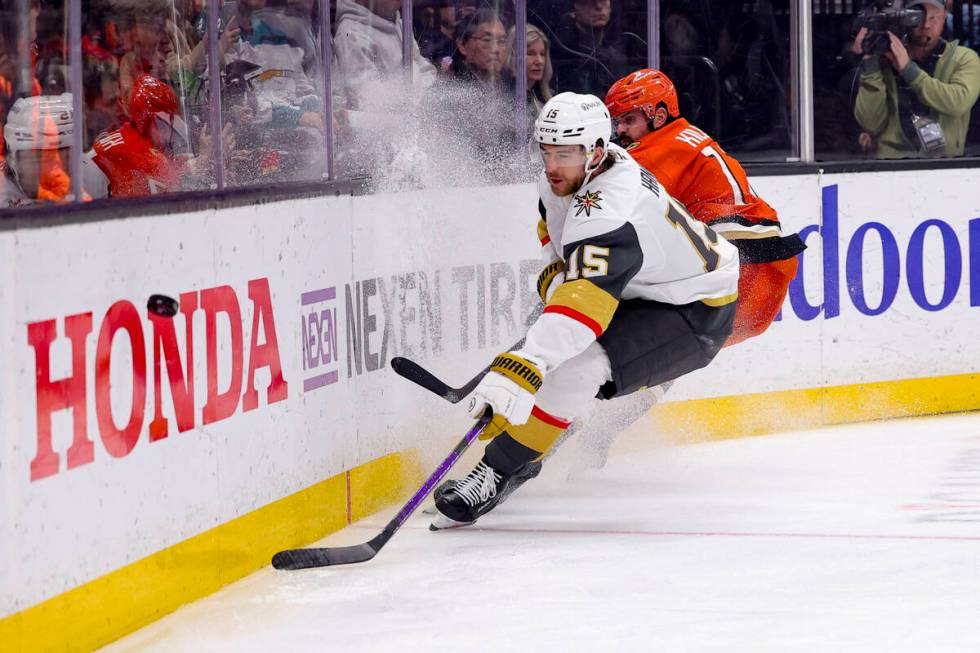 Vegas Golden Knights defenseman Noah Hanifin, left, and Anaheim Ducks left wing Alex Killorn ch ...