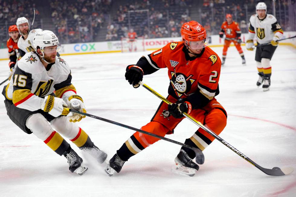 Anaheim Ducks center Isac Lundestrom, right, vies for the puck against Vegas Golden Knights def ...